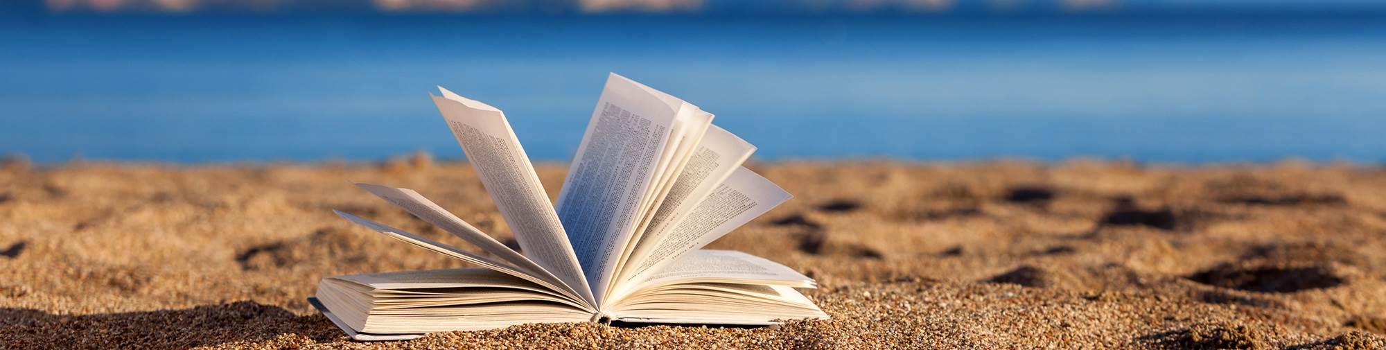 Open book on beach
